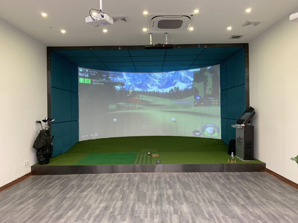 Family using indoor golf simulator for entertainment