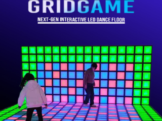 Interactive LED floor tile grid team-building challenge game in action