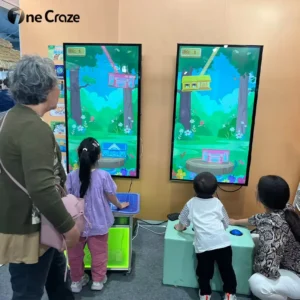 Two young boys playing together, competing for the high score
