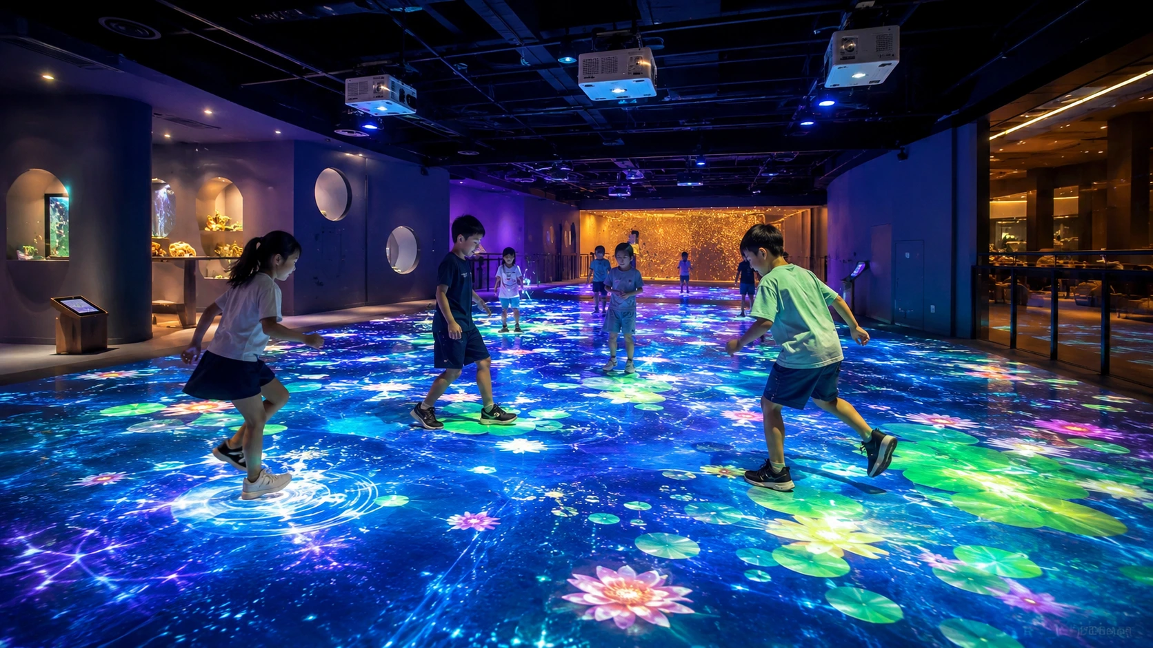 Children playing on an interactive floor projection system in an immersive indoor entertainment space